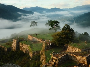 Ruined Takeda Castle on the hill in the sea of clouds