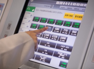 Push the fare on a vending machine